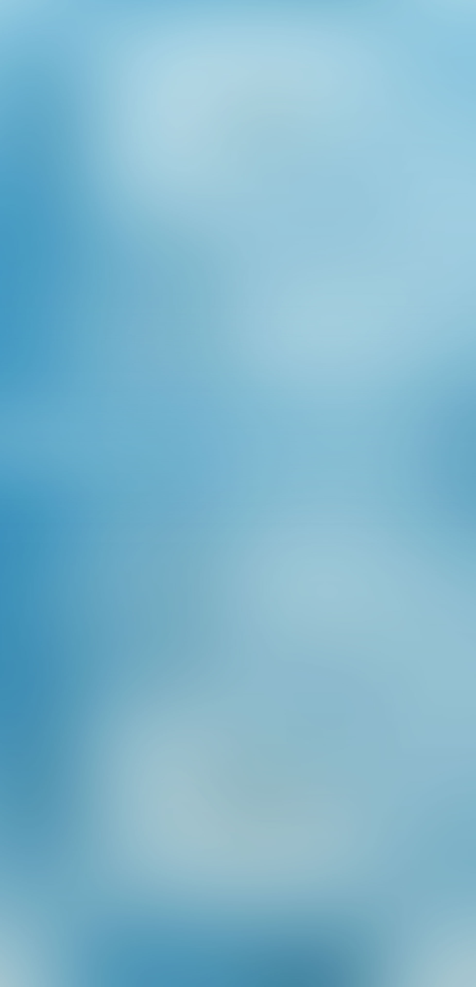 Abstract blurred blue background with soft light gradients, calming mood.